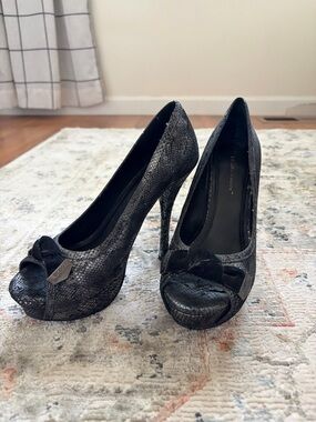 BCBGeneration Black Snakeskin Peep-Toe Platform Pumps with Bow
